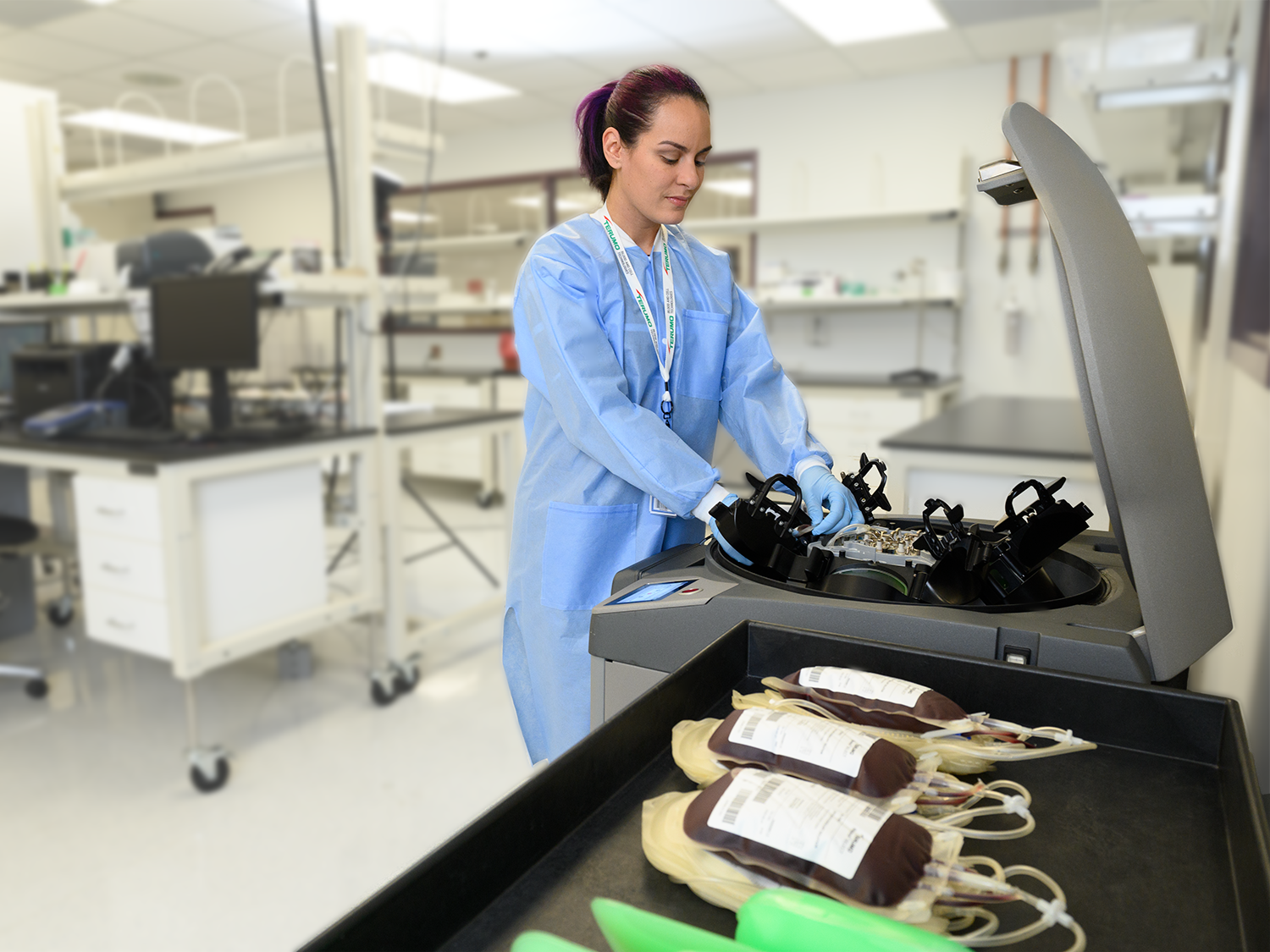 Blood center worker with Reveos