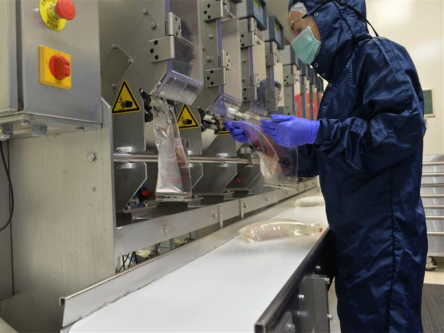 Operator filling bags with solutions